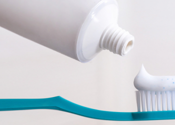 How is microbiological risk assessed in cosmetics?